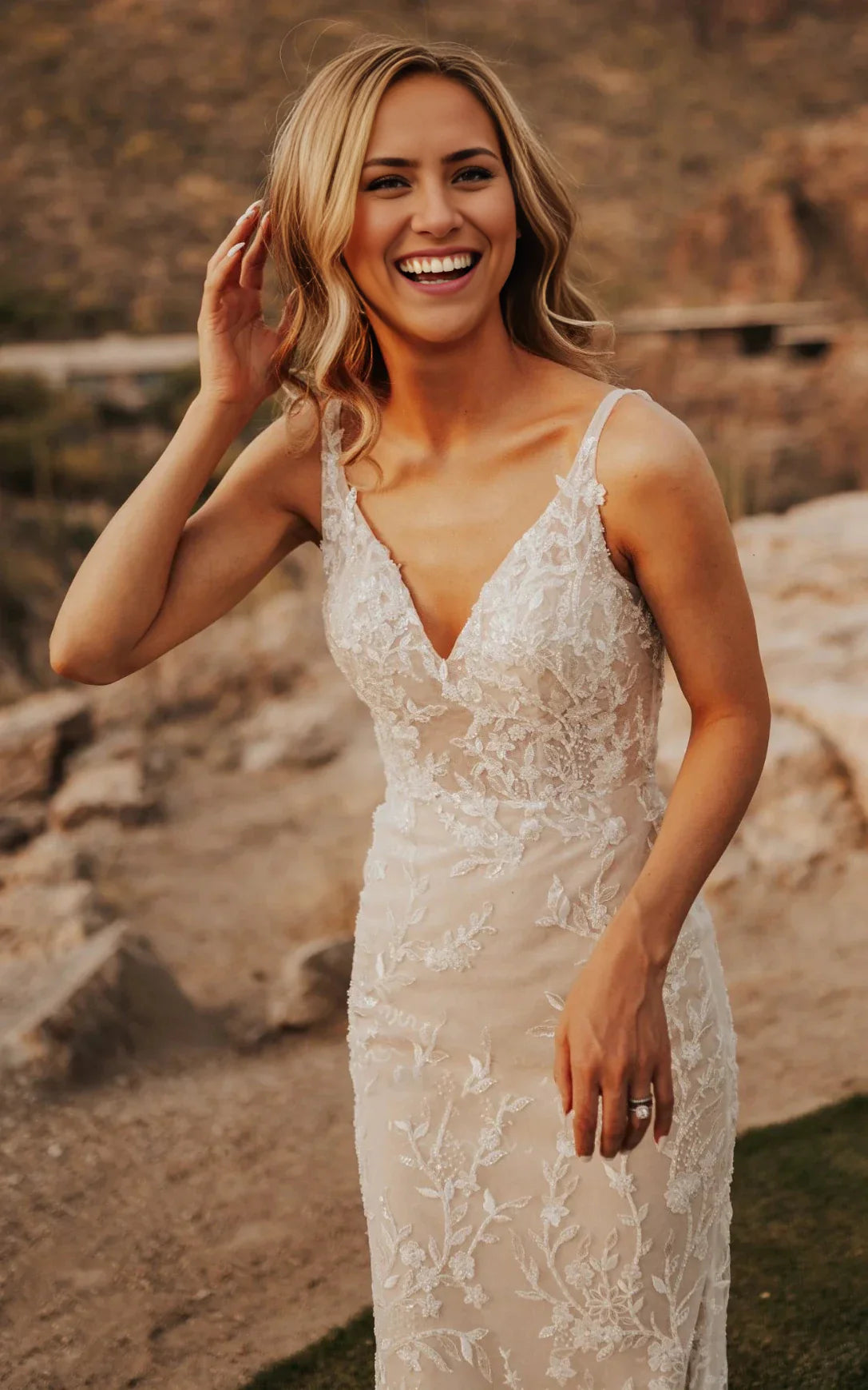 Close-up view of the lace detailing and V-neckline on the mermaid wedding dress.