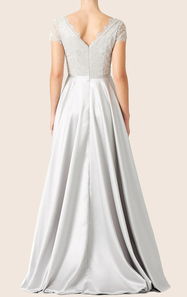 Close-up of lace and satin details on the bodice of the formal gown.