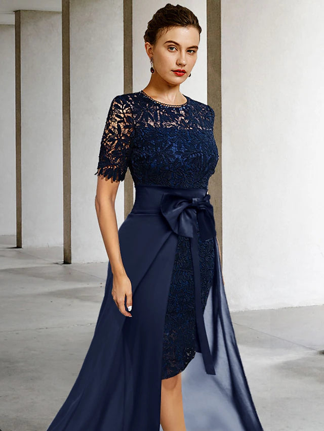 Side view of the lace sheath dress, highlighting short sleeves and bow detail.