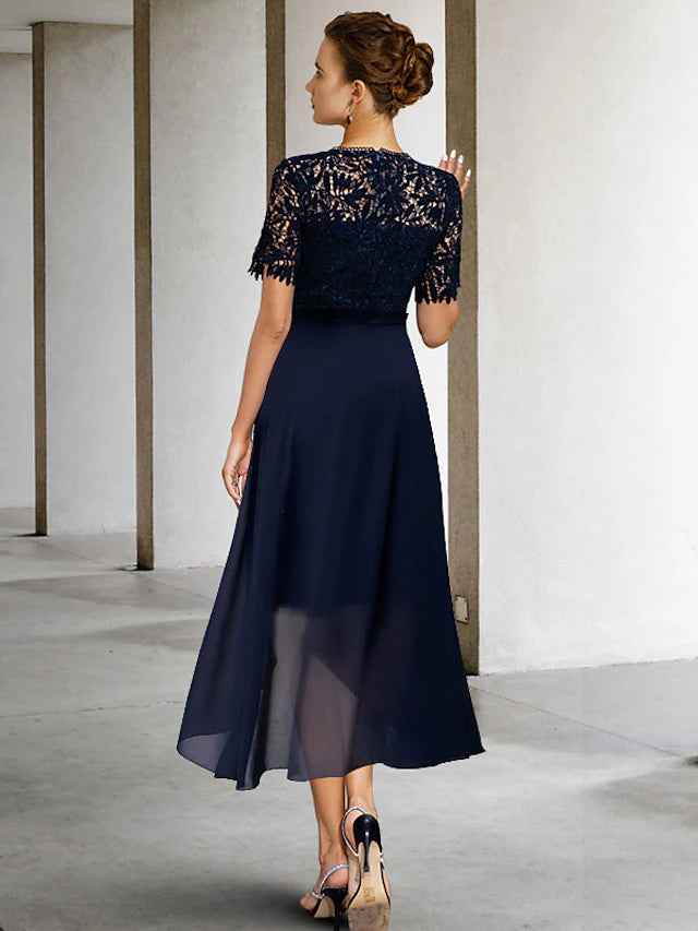 Back view of the elegant knee-length sheath dress, showing lace and silhouette.