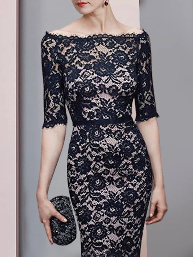 Back view of the floor-length formal gown with lace detailing.