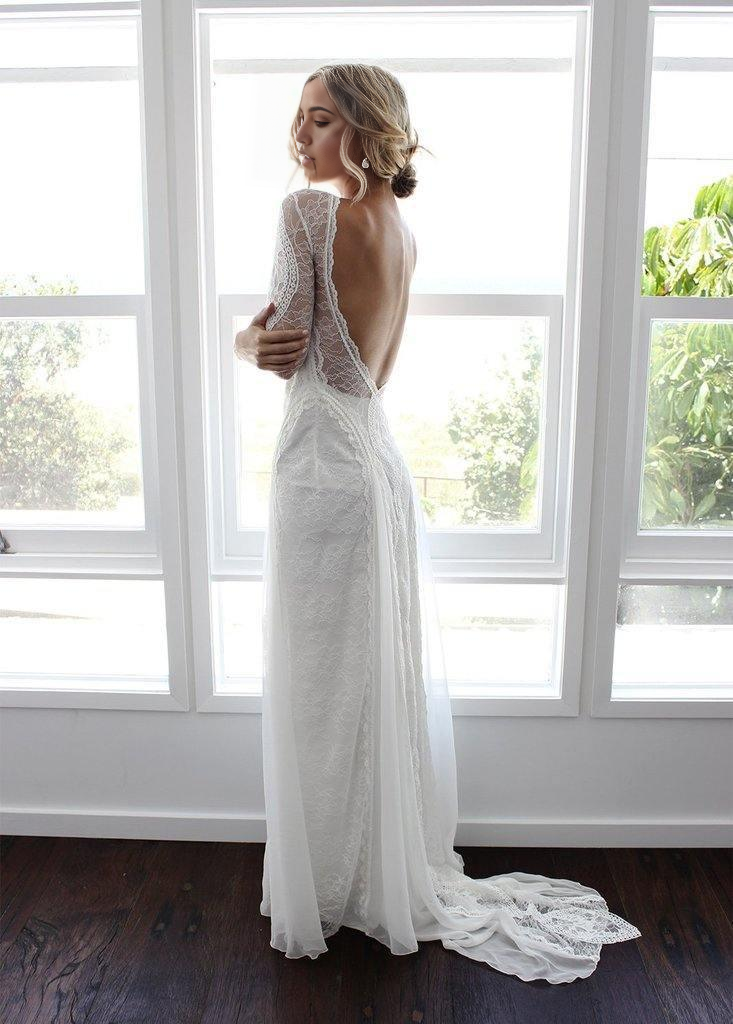Close-up of delicate lace detailing on the long sleeve bridal gown.