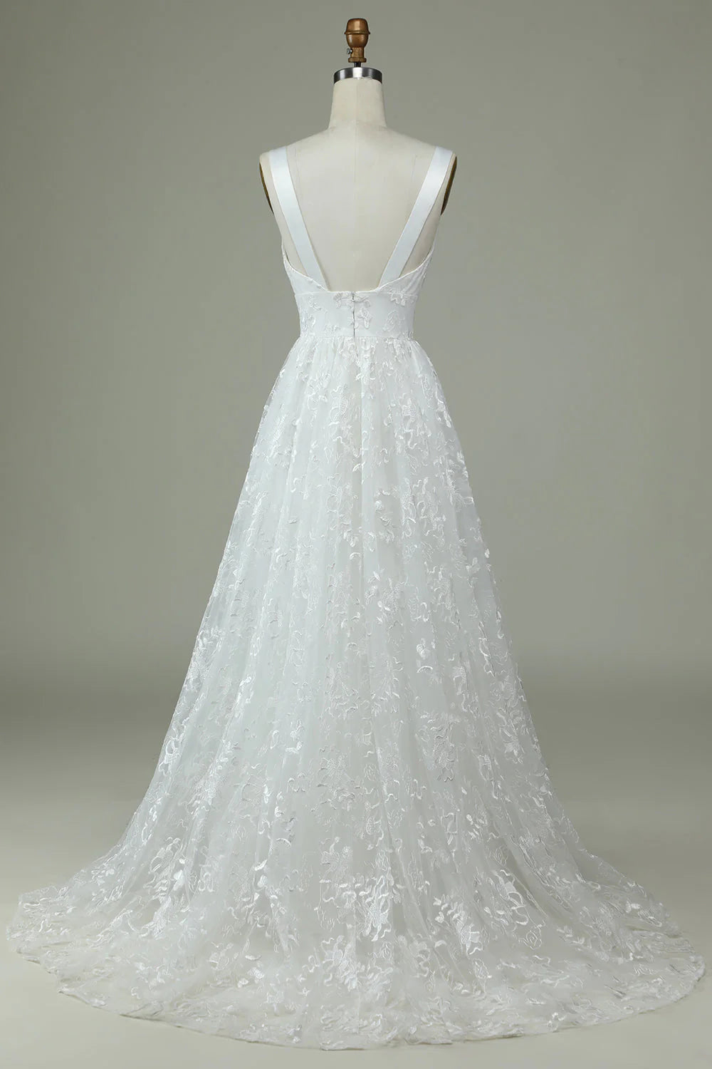 Back view of an ivory A-line wedding gown with lace details.
