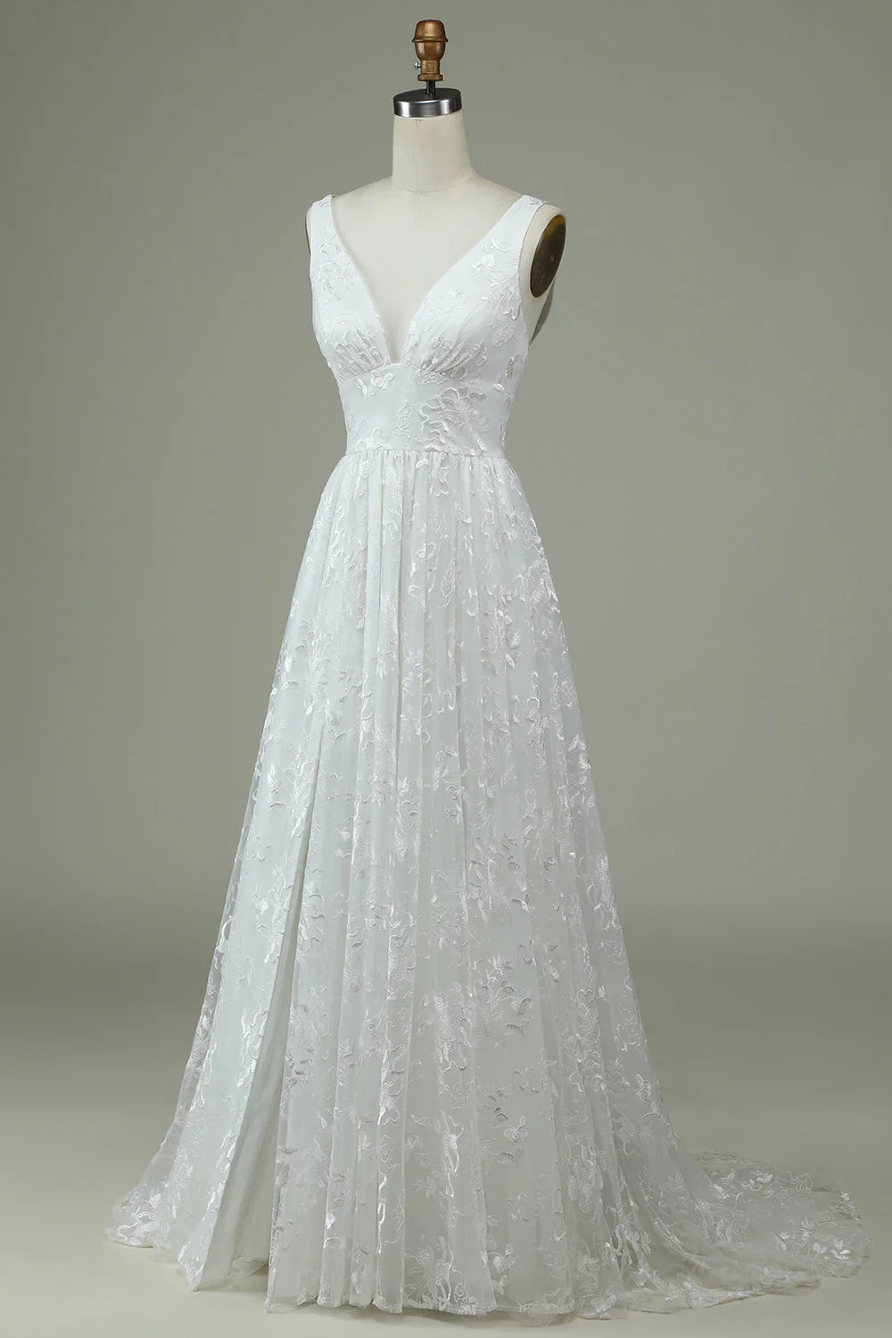 Side view of a bride wearing a lace maxi wedding dress.