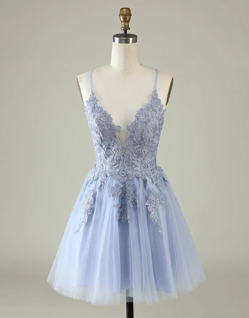 Lavender short homecoming dress with spaghetti straps and appliques.