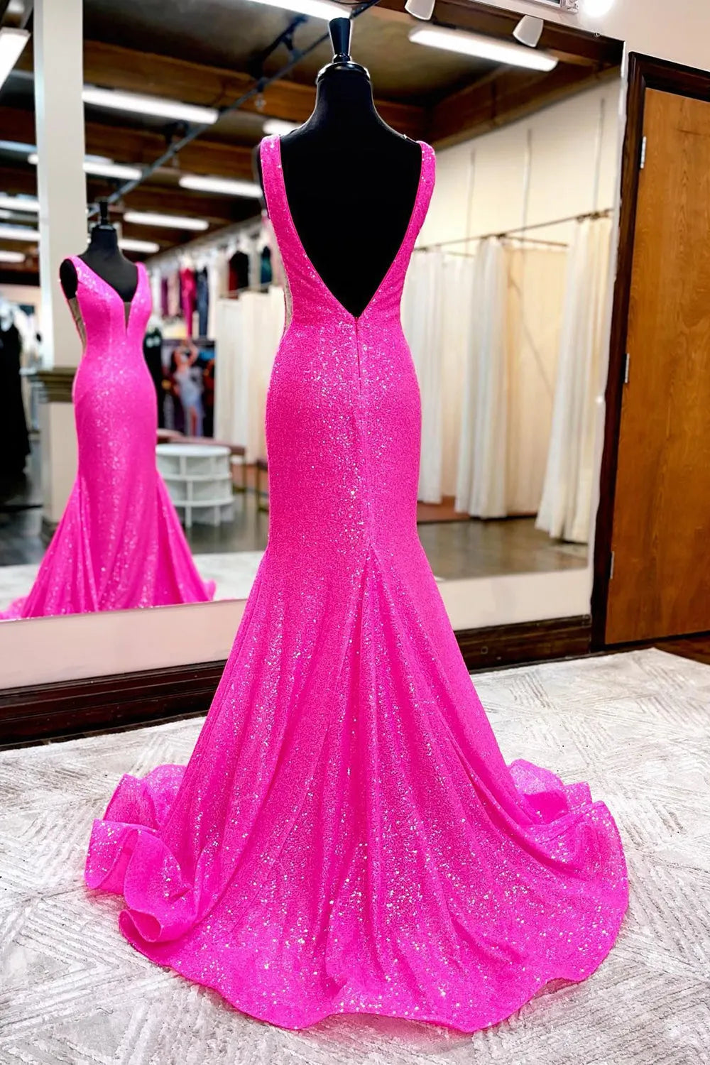 Side view of light blue mermaid gown with strapless sweetheart neckline.