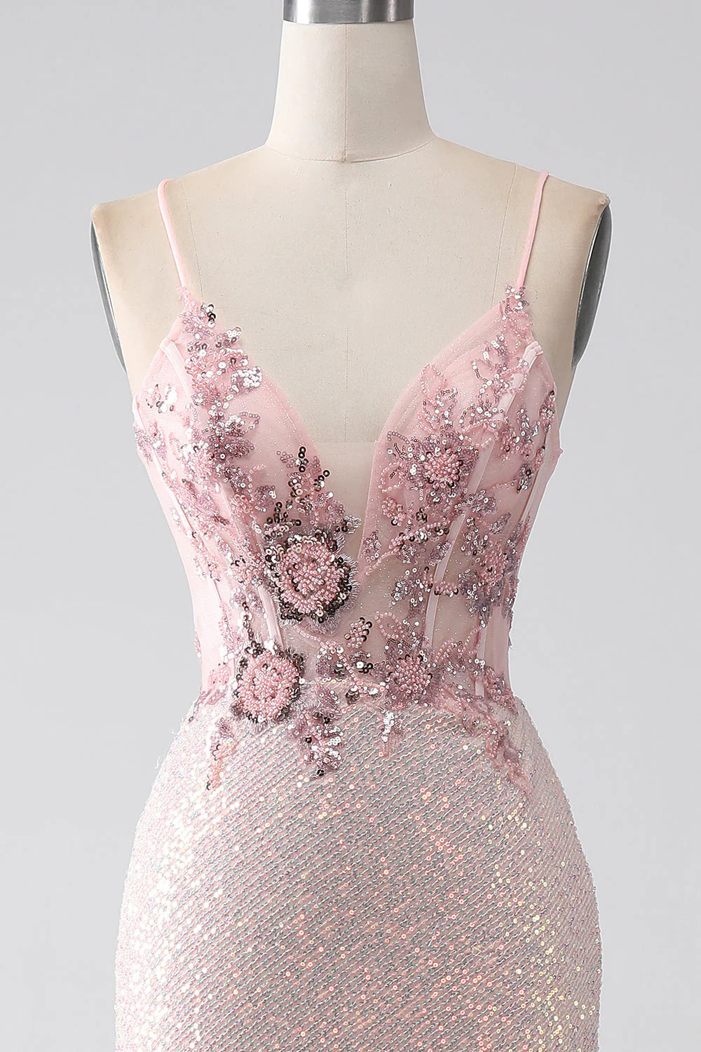 Back view of the light pink mermaid prom dress, highlighting the fitted bodice.