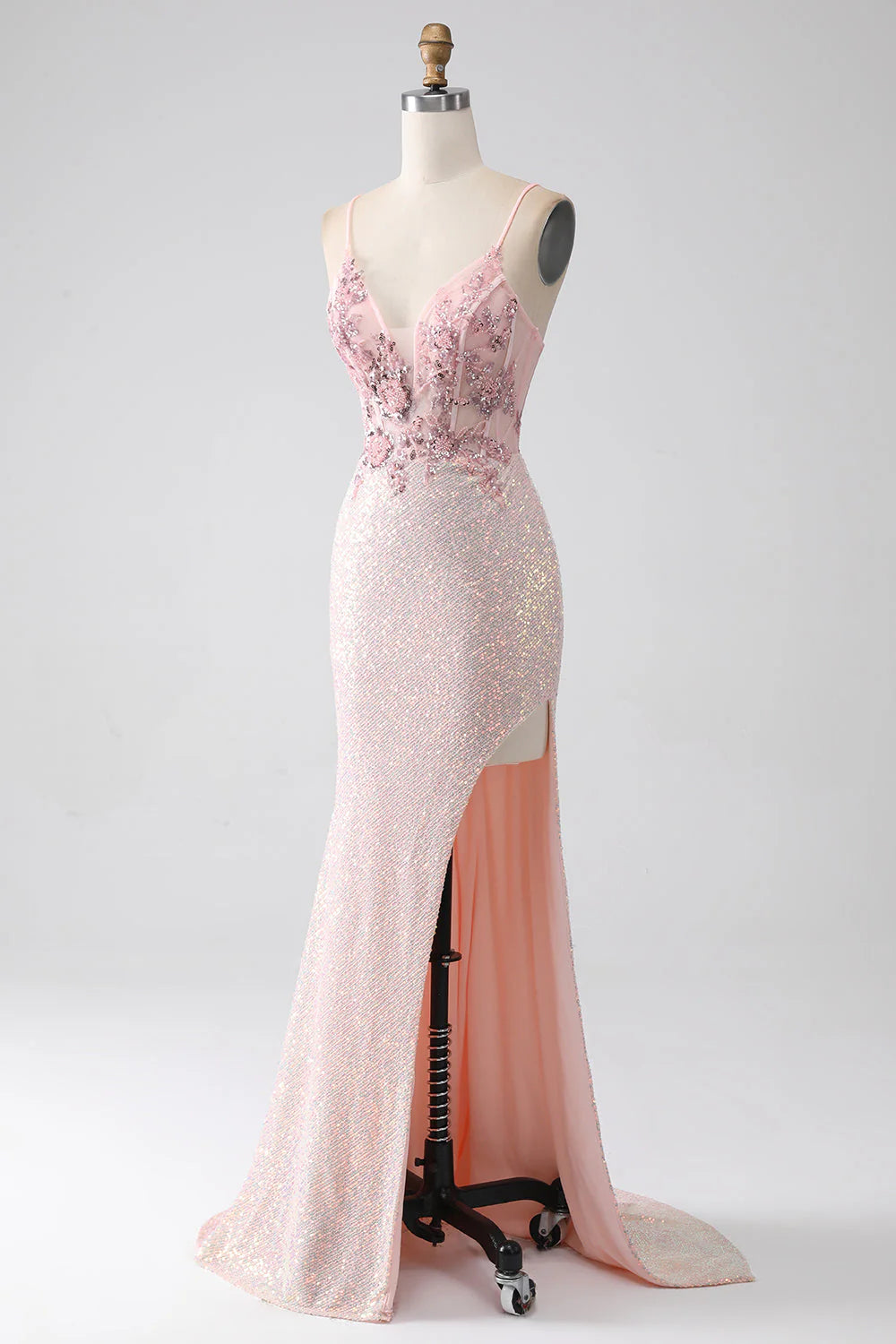 Close-up of the light pink fabric and details of the mermaid prom dress.