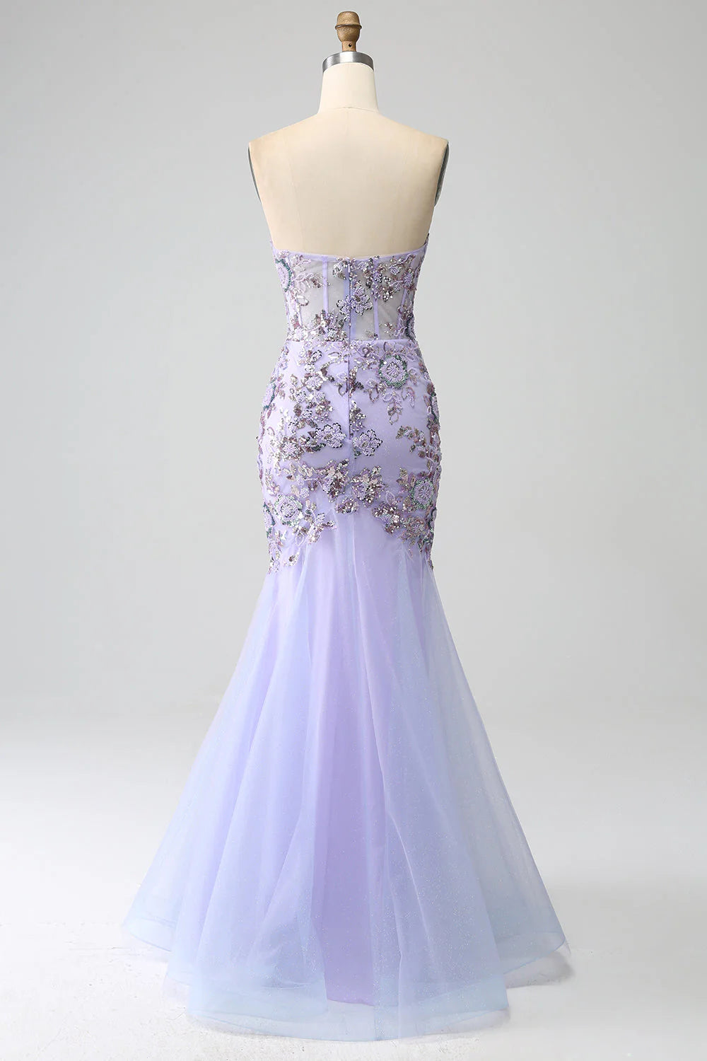 Back view of light purple mermaid strapless prom dress with corset detailing.
