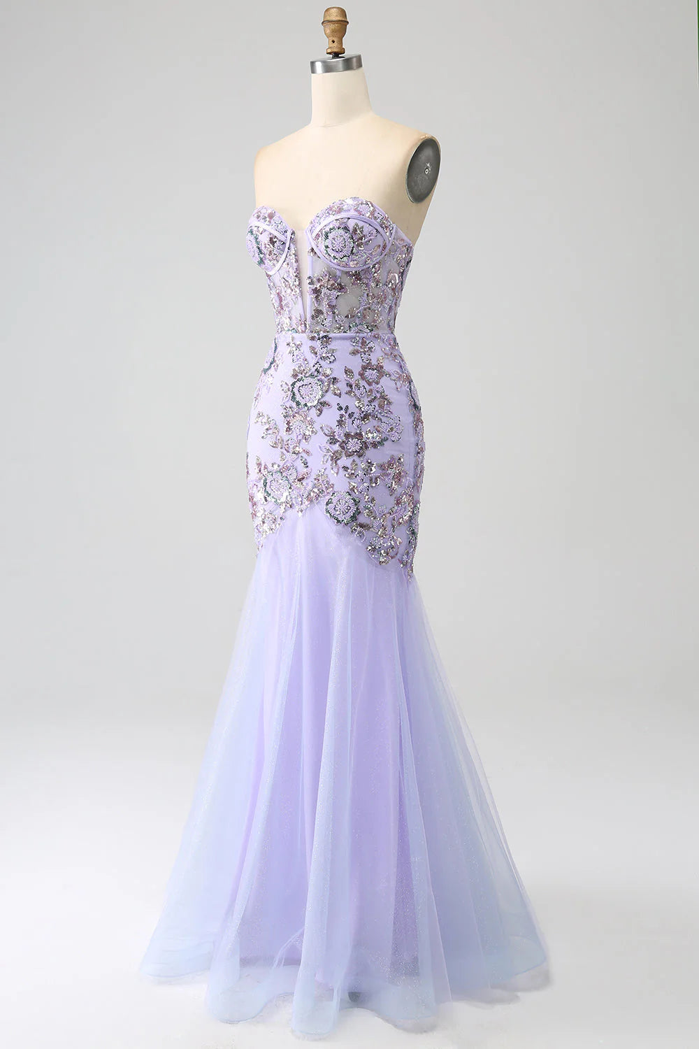 Close-up of beaded detail on light purple strapless mermaid dress.