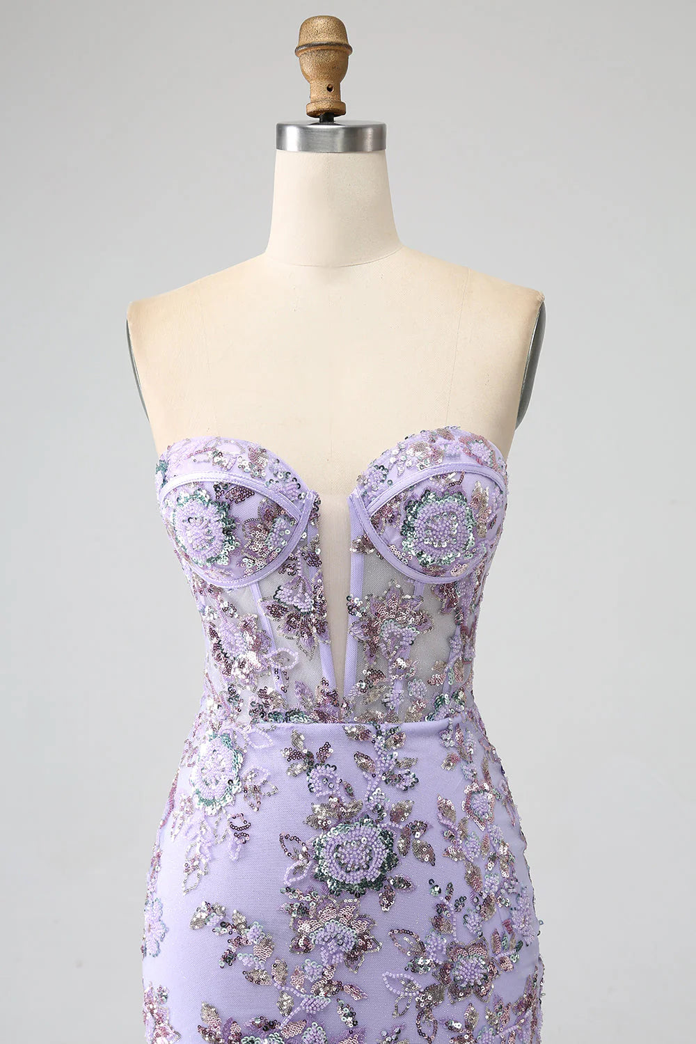 Side view of light purple mermaid prom dress showcasing silhouette.