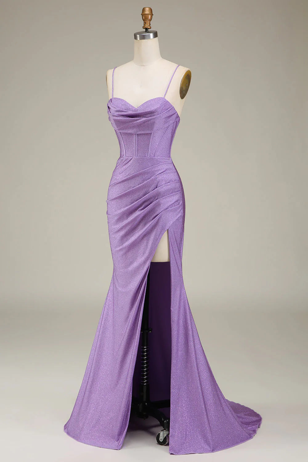 Side view of a woman in a lilac formal gown, highlighting the corset detail.