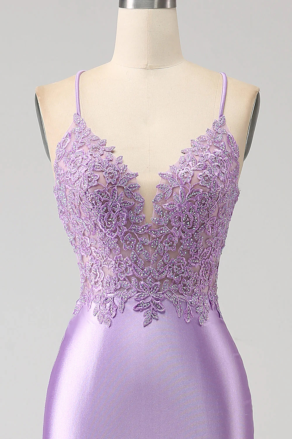 Close-up of appliques on the lilac mermaid prom dress.