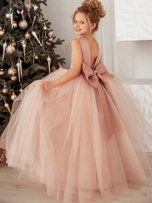 Little girl wearing a dusty rose lace tutu maxi dress.
