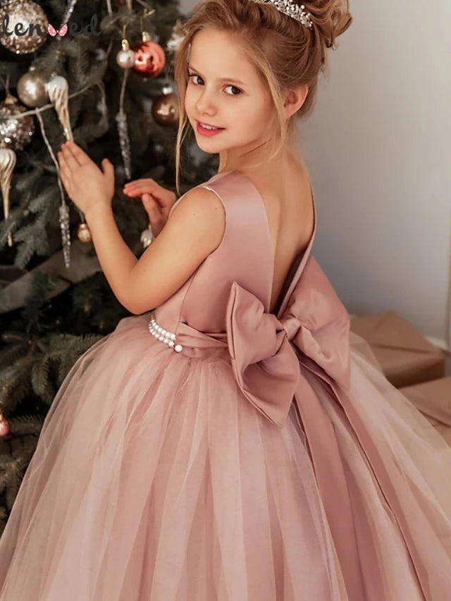 Back view of the dusty rose flower girl dress with a high neckline.