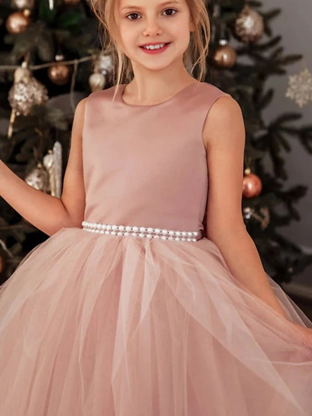 Side profile of the elegant dusty rose princess dress.