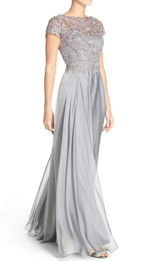 Detail of lace and chiffon fabric on a long sleeve dress.