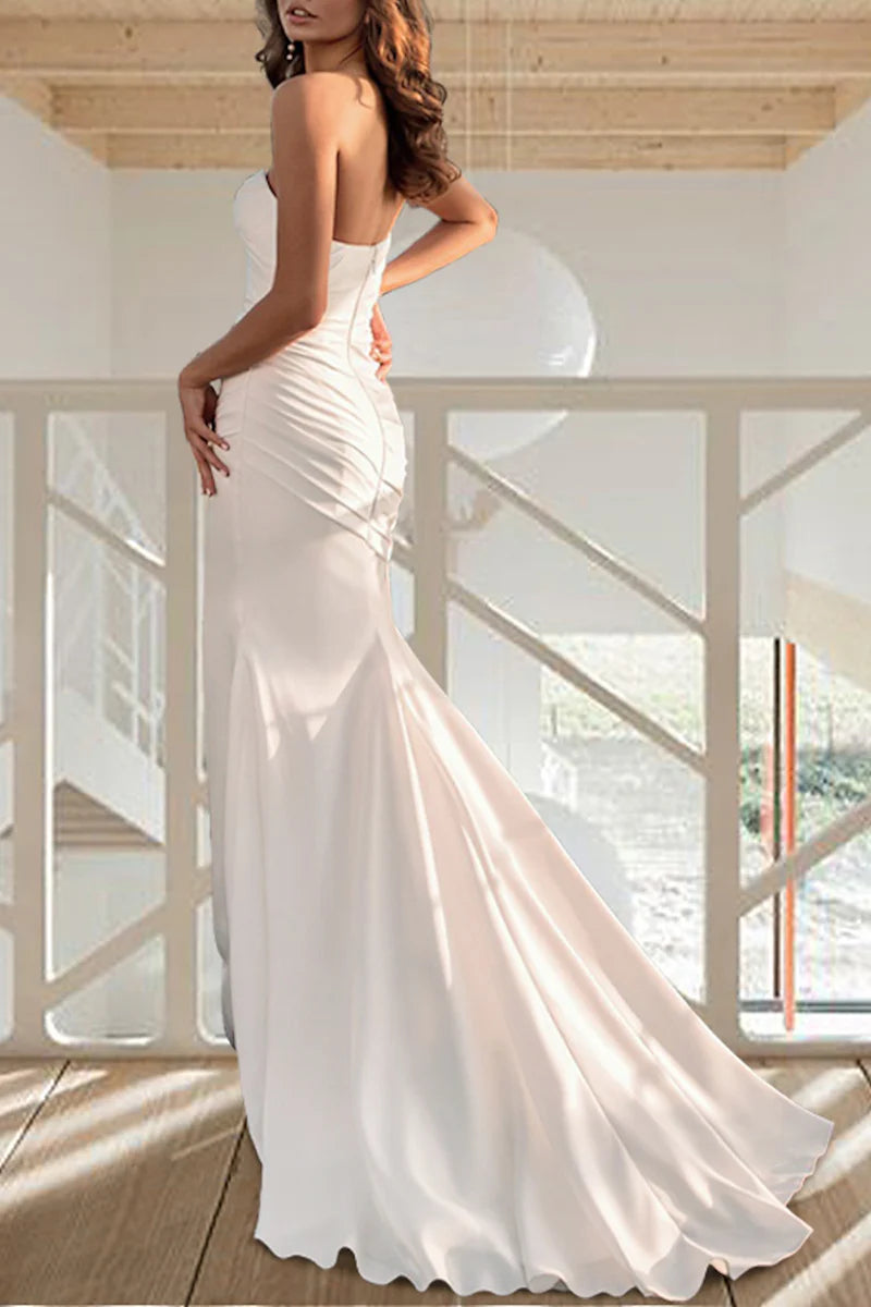 Back view of a long sleeve mermaid trumpet wedding dress with a sweep train.