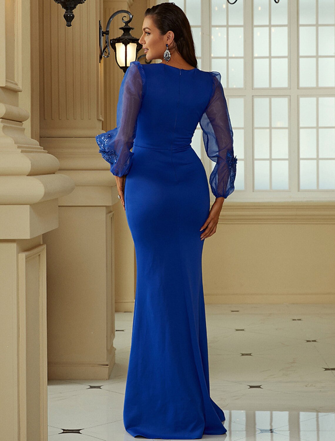 Back view of the mermaid trumpet evening gown showing the sweep train.