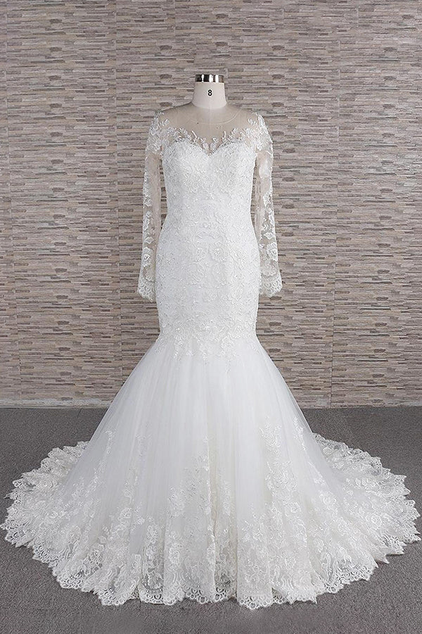 Model wearing an elegant long sleeve sweetheart lace backless wedding dress.