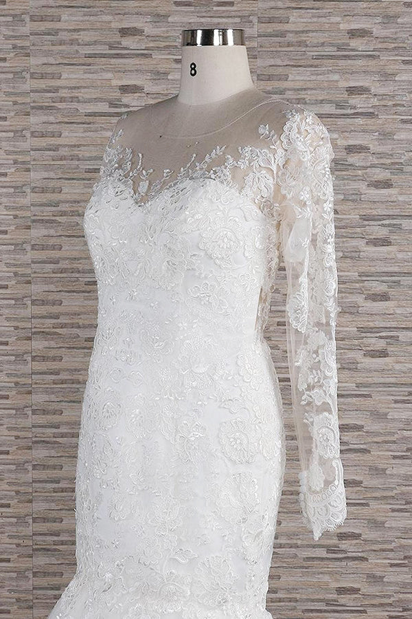 Back view of the long sleeve backless wedding dress with delicate lace details.