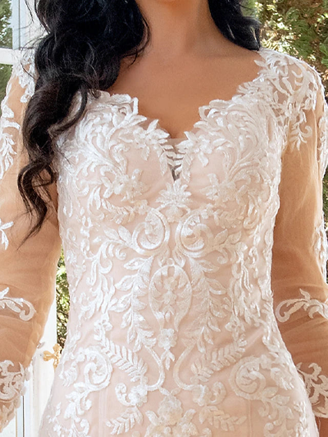 Back view of the lace applique mermaid wedding dress with a long train.