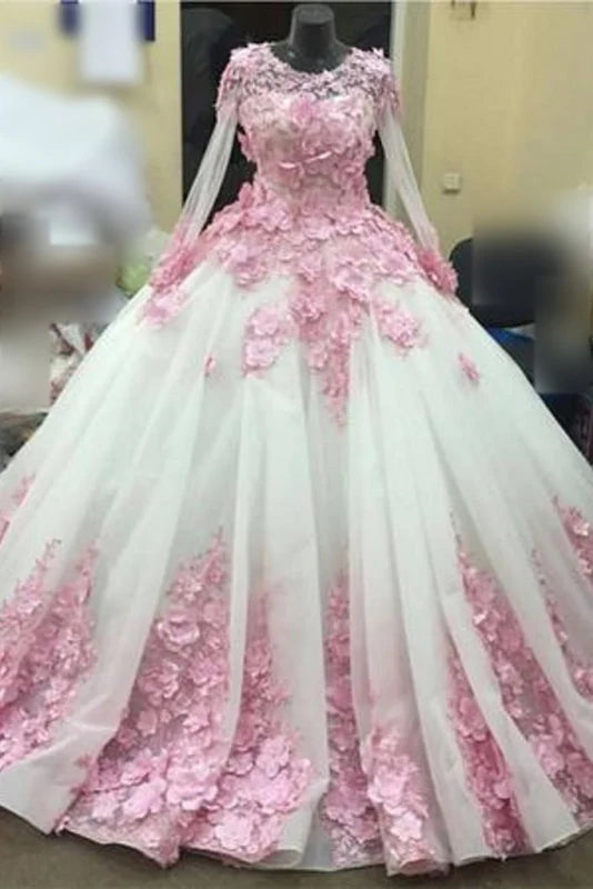 Elegant long sleeve tulle ball gown with floral appliques.