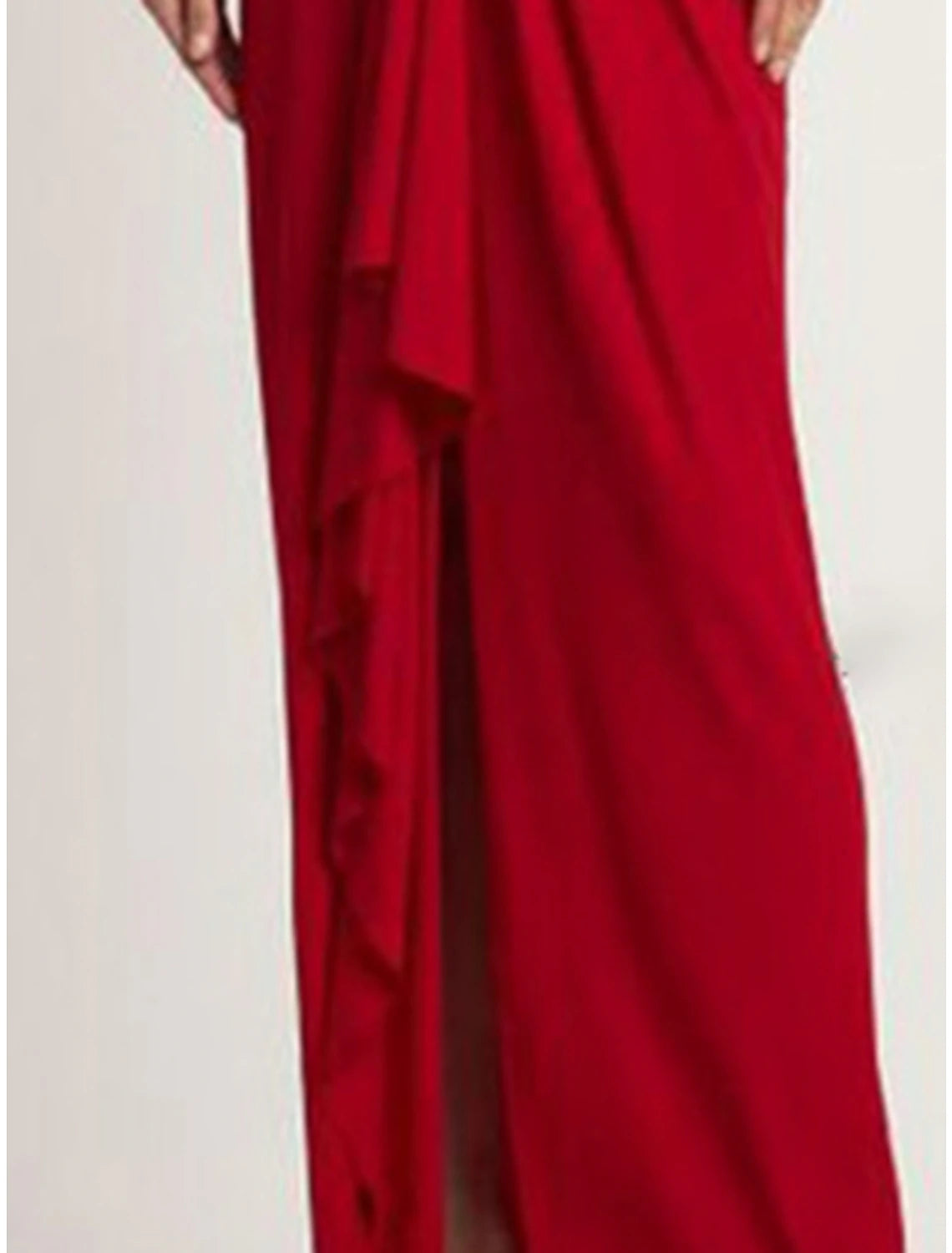 Close-up of the V-neck and long sleeves on a red evening gown.