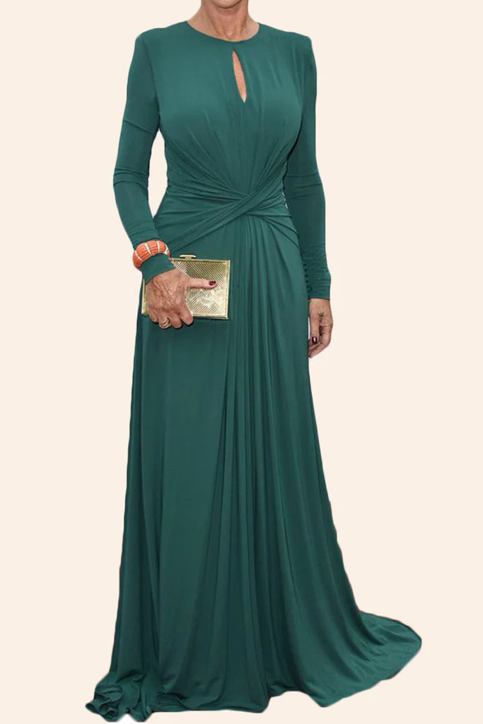 Woman wearing an elegant long sleeve V-neck teal maxi gown.