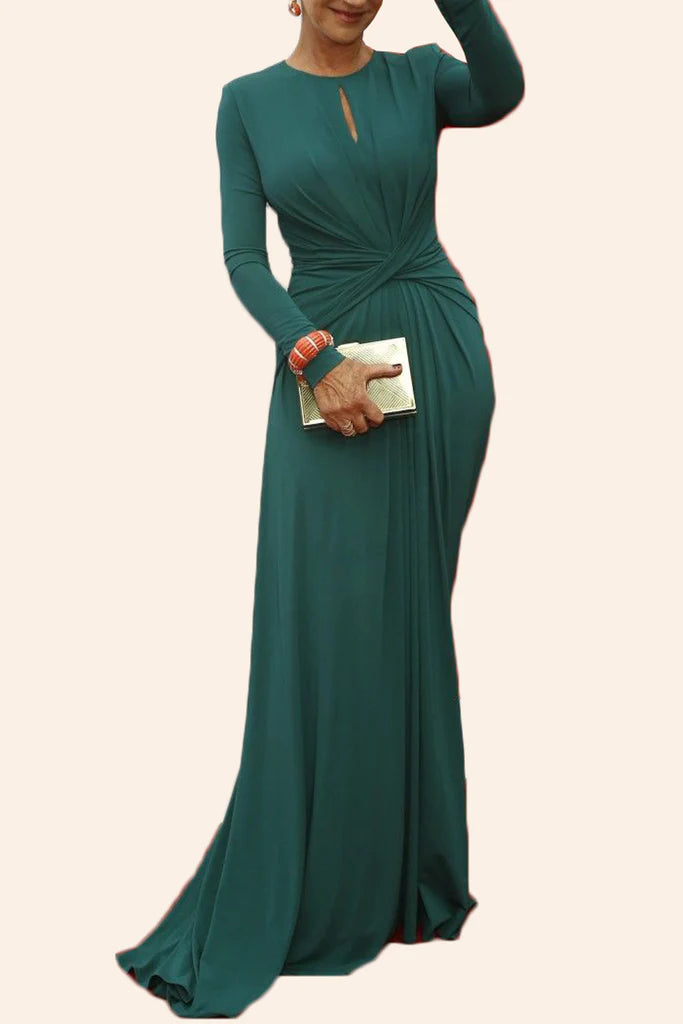 Back view of a woman in a formal teal evening dress.