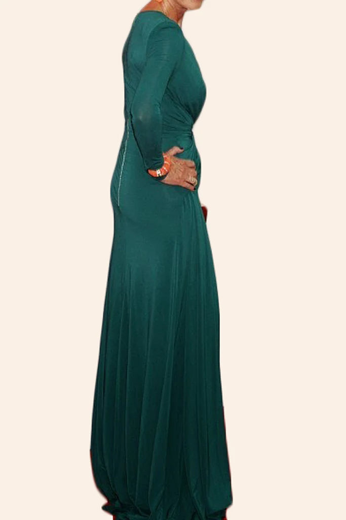 Side profile of a woman showcasing a teal mother of the bride gown.