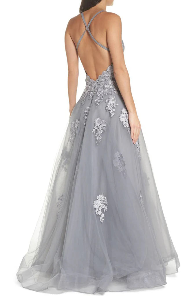 Close-up of the intricate lace and soft tulle fabric on the prom dress.