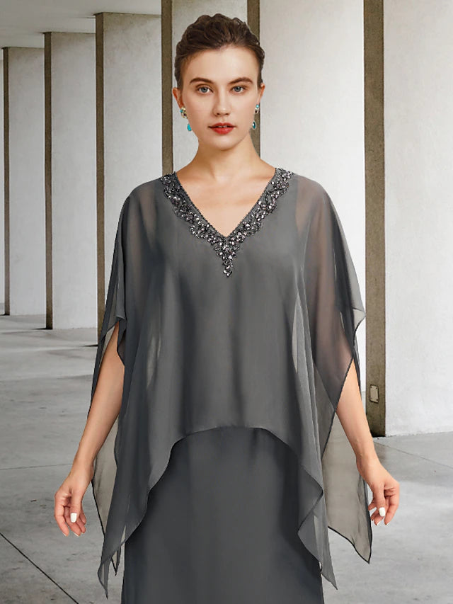 Side view of the floor-length A-line Mother of the Bride dress, showing the flowing chiffon and ruffles.