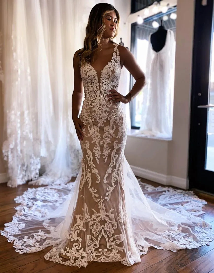 Elegant dark champagne mermaid wedding dress with intricate appliques.