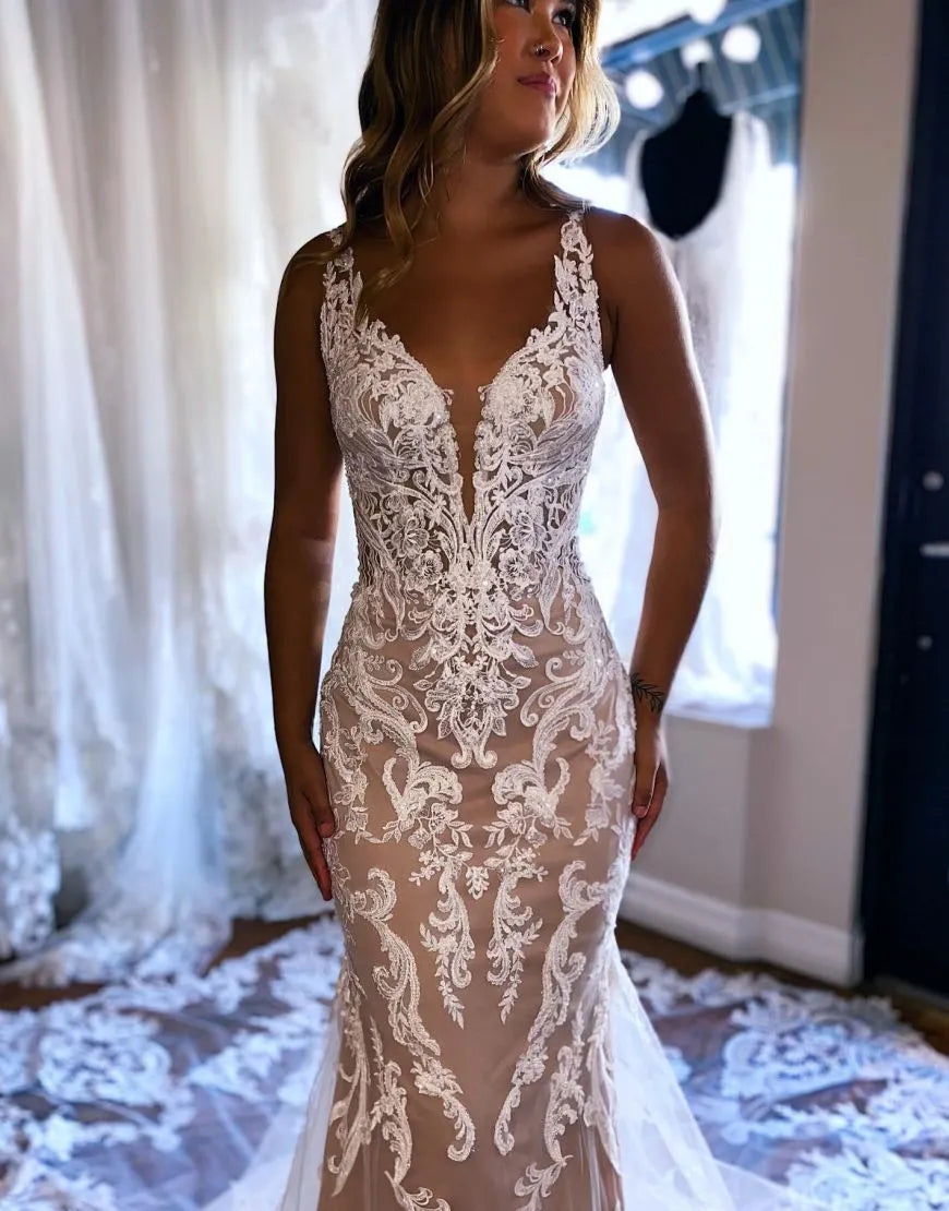 Side view of dark champagne mermaid bridal gown with delicate appliques.