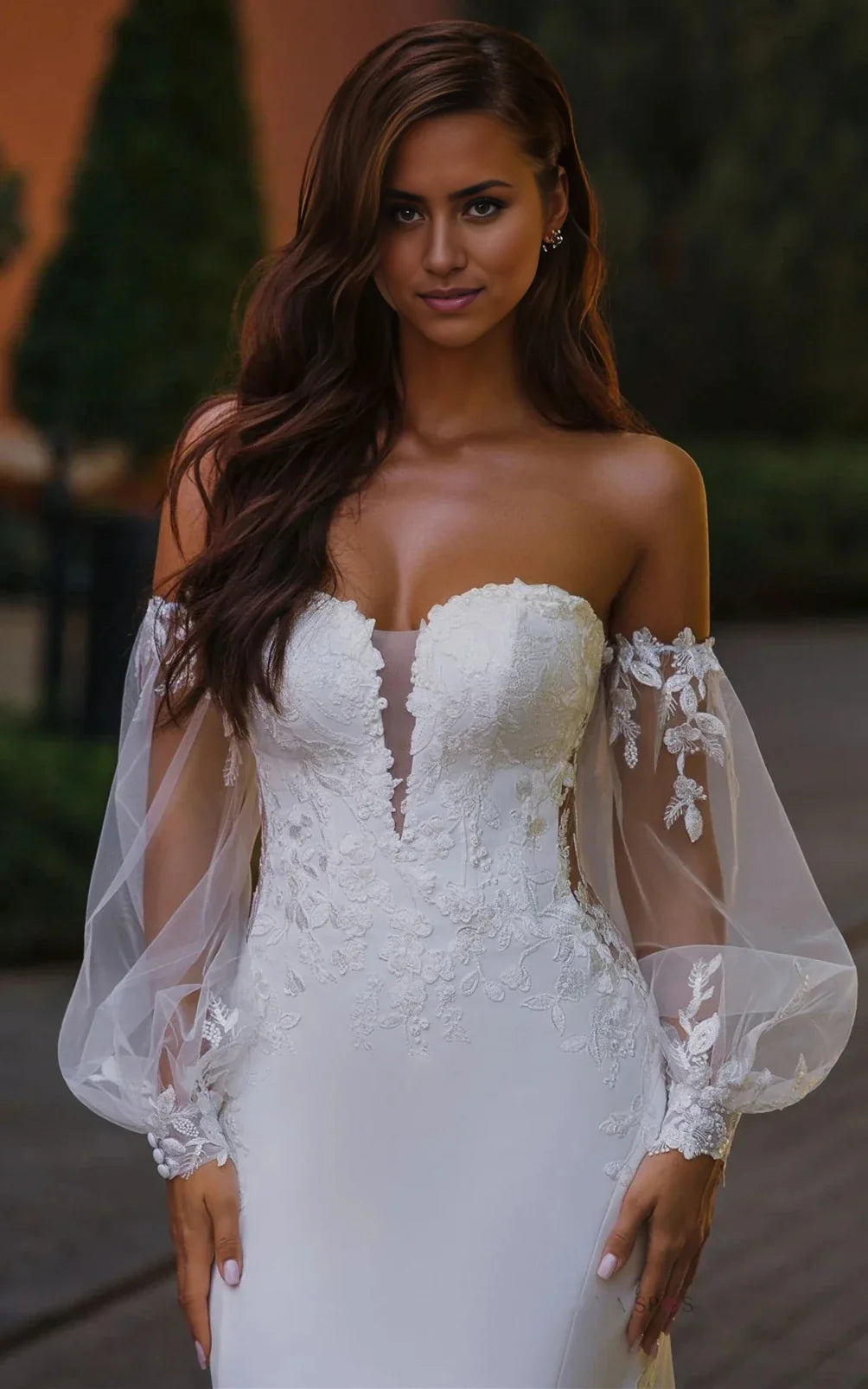 Close-up of delicate appliques on the bodice of a mermaid wedding dress.