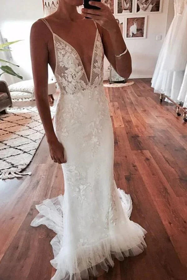 Elegant mermaid wedding dress with deep V-neck and lace details.