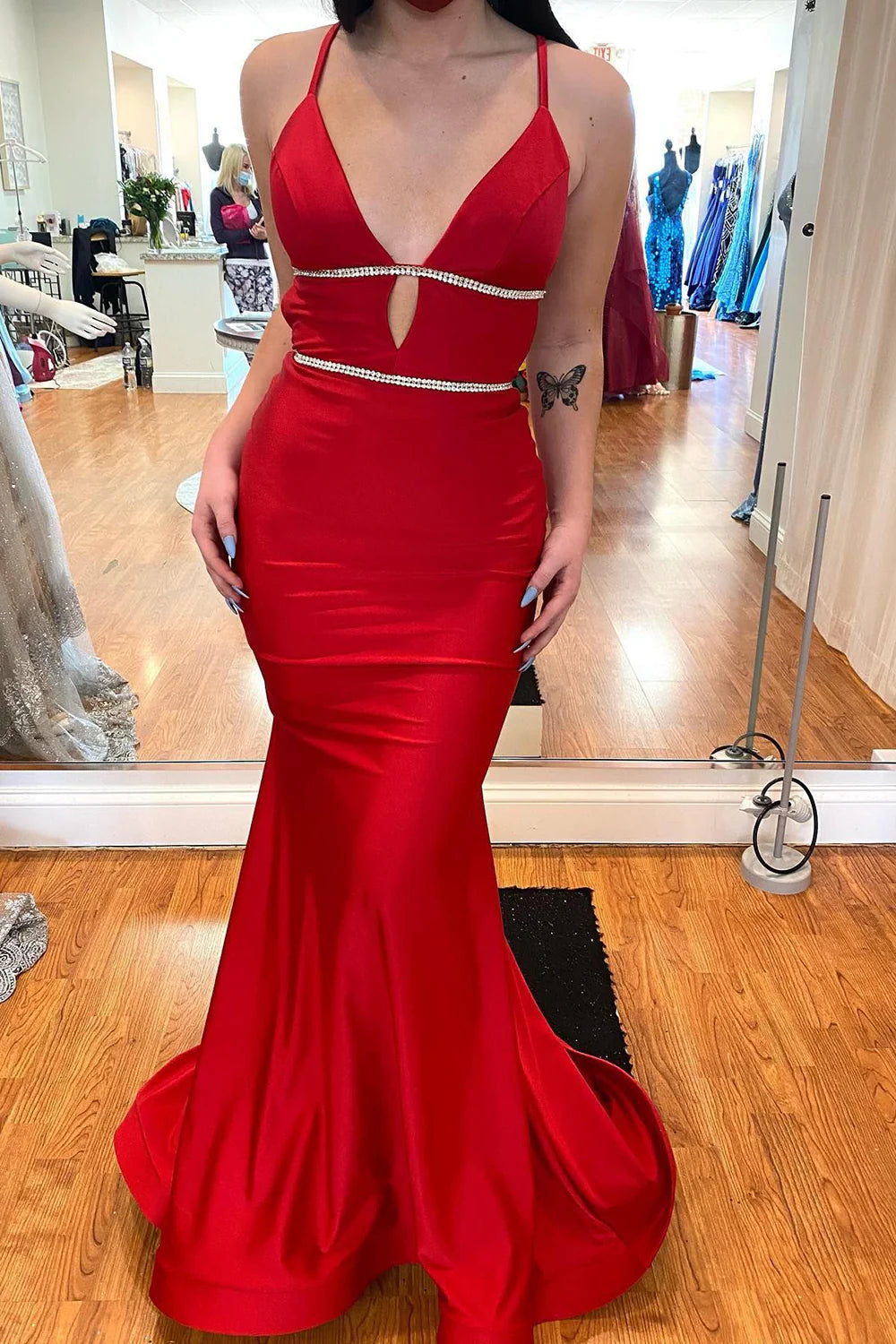 Side view of the mermaid silhouette satin gown, showcasing its elegant drape.