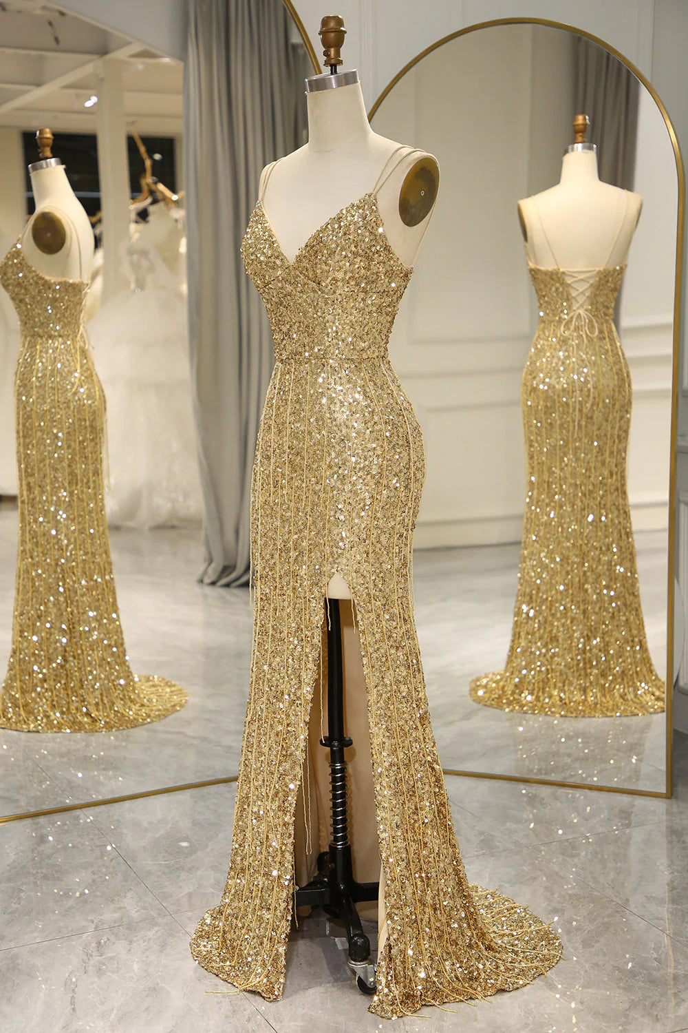 Detail of the golden mermaid dress fabric and leg slit.
