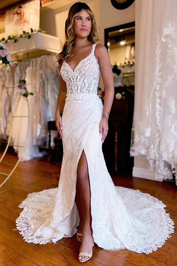 Elegant mermaid wedding dress with backless V-neck and lace appliques.