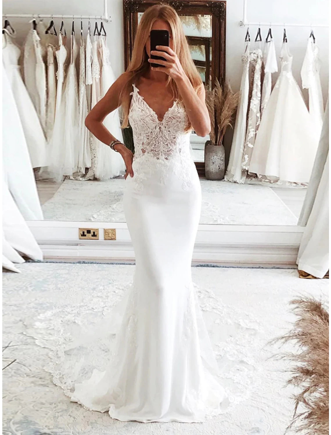 Elegant white mermaid wedding dress with appliques and court train.