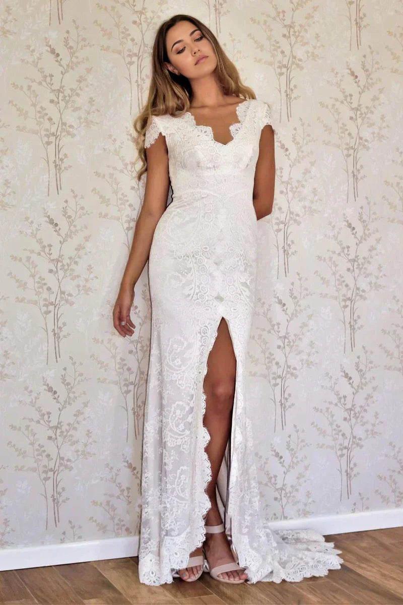 Elegant mermaid wedding dress with cap sleeves and a V-neckline.