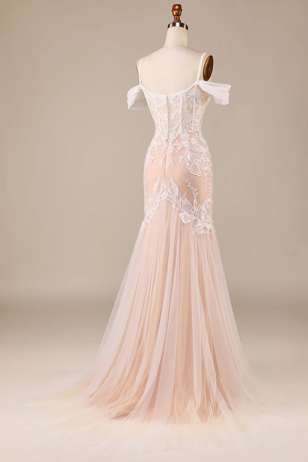 Side view of the mermaid cold shoulder wedding dress, showcasing intricate appliques.