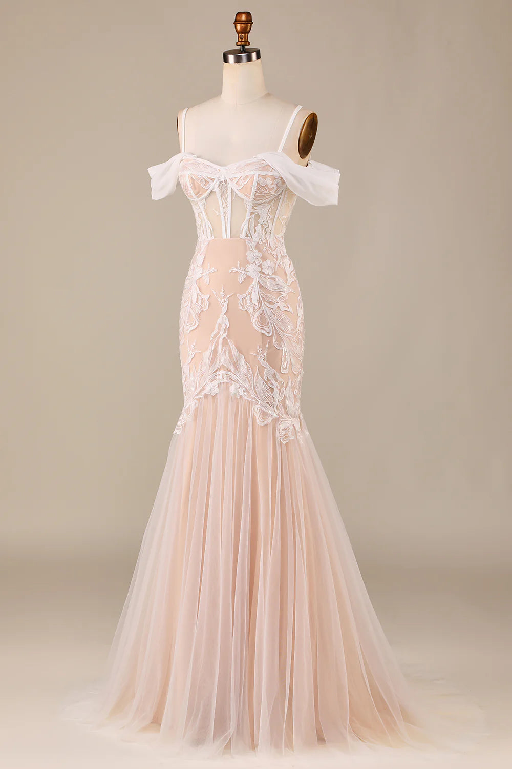 Close-up of the delicate appliques on the mermaid cold shoulder wedding dress.