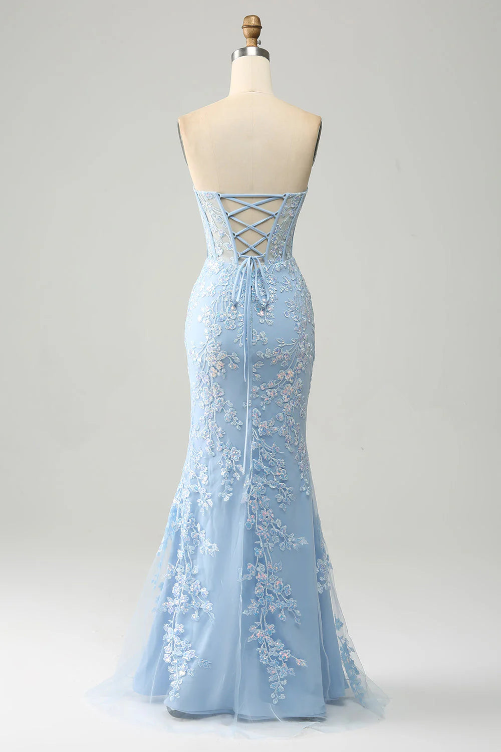 Close-up of the light blue corset bodice with intricate appliques.