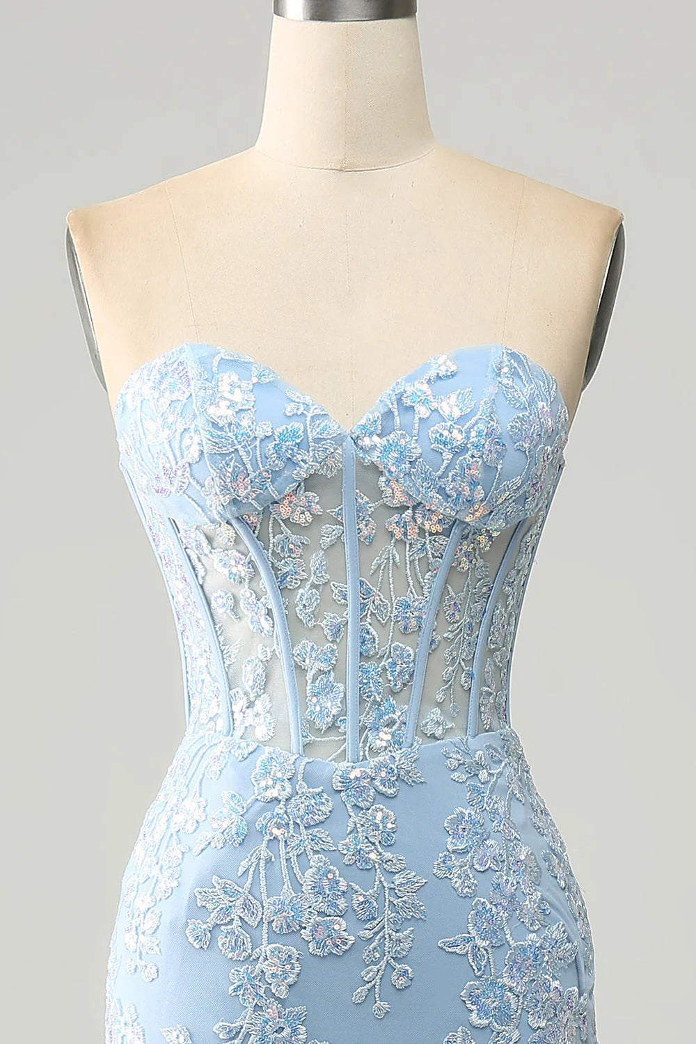 Back view of the light blue mermaid prom dress, featuring a lace-up corset detail.