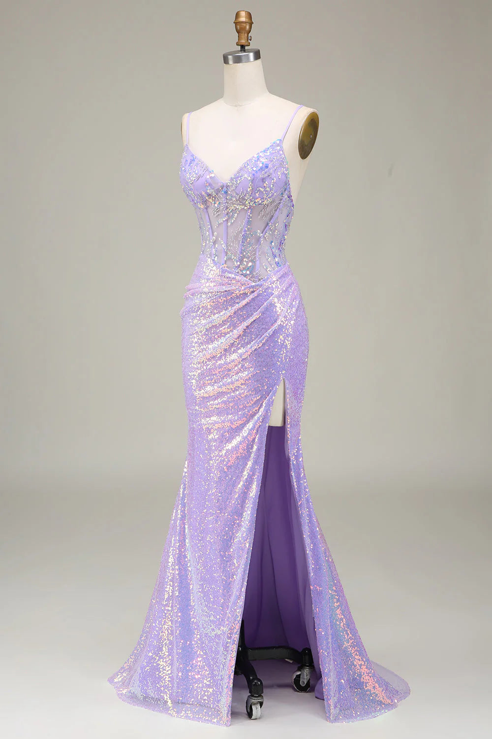 Side view of a light purple mermaid corset prom dress, highlighting the slit and silhouette.