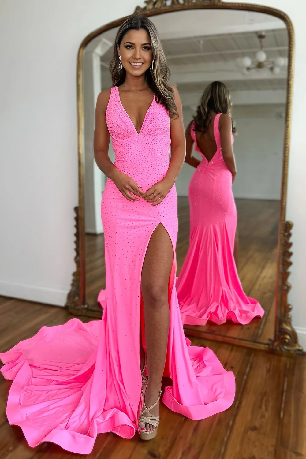 Close-up of the intricate beading on the mermaid deep V-neck dress.