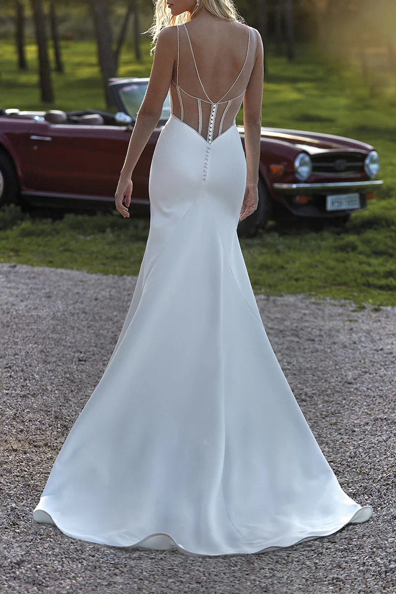 Back view of a mermaid wedding dress showcasing its elegant silhouette and bead details.
