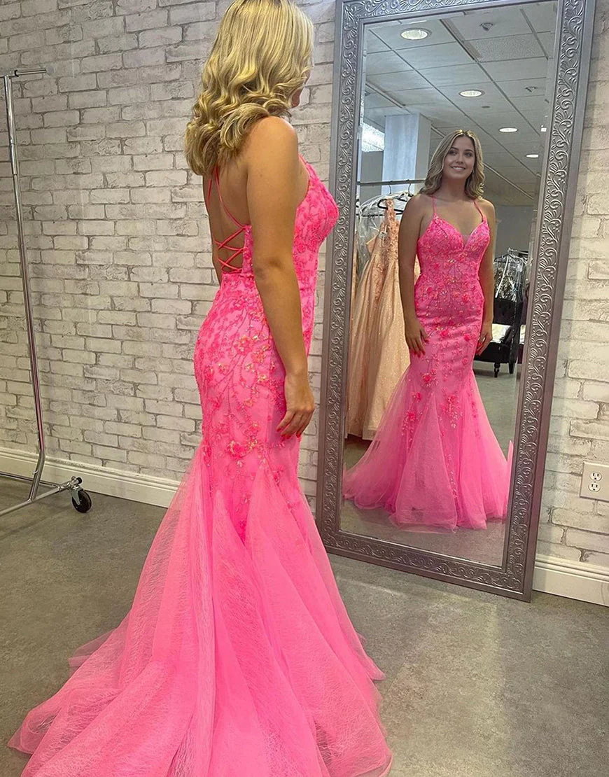 Back view of a mermaid deep V-neck satin prom dress showing cross back detail.